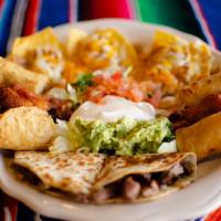 Cancun Mixto · A combination of chicken nachos, steak quesadillas, chicken flautas and chicken wings. Serve...