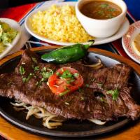 8 oz. Carne Asada Fajita · Served with onion rings and green peppers.