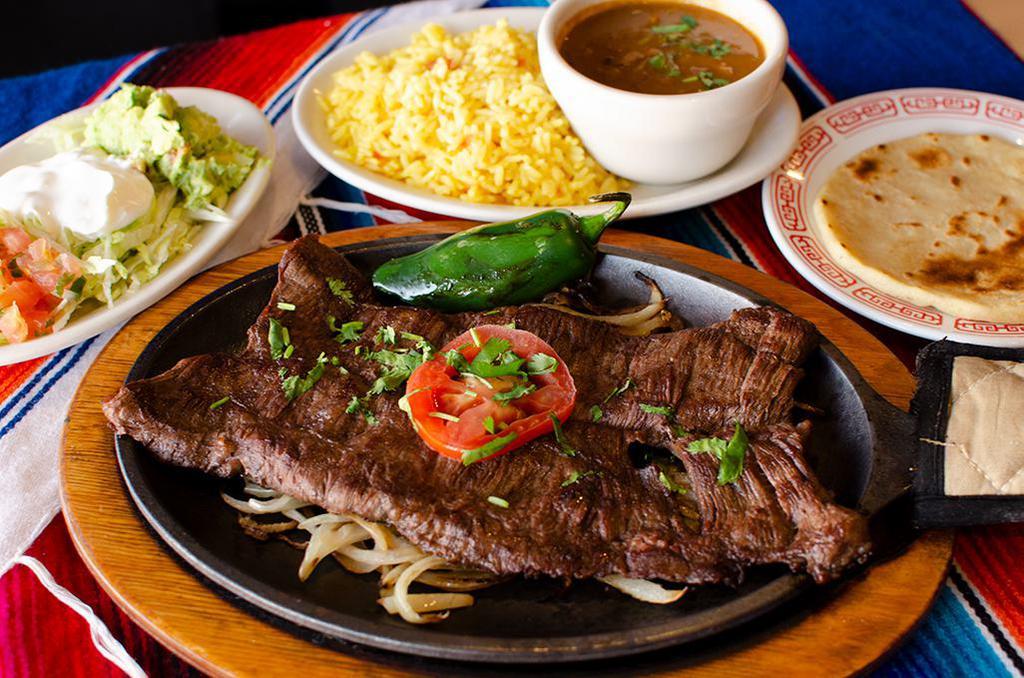8 oz. Carne Asada Fajita · Served with onion rings and green peppers.