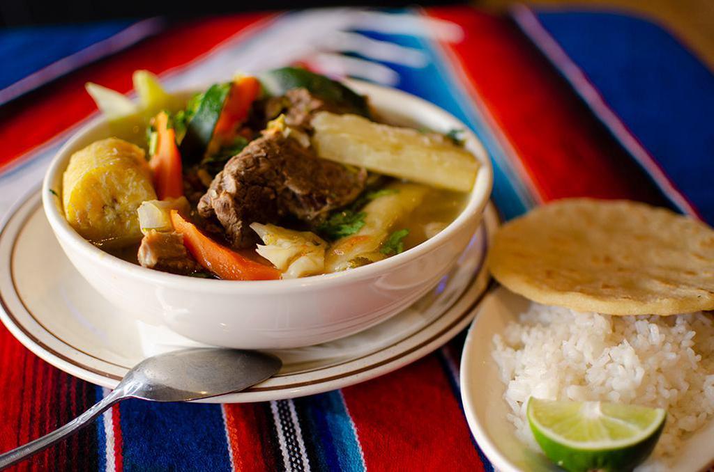 Sopa de Res · Beef soup, served with rice and tortillas. Served with cilantro on top.