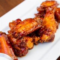 Buffalo Wings · 8 wings tossed in our house sweet buffalo sauce.