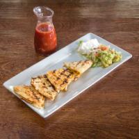 L-Grilled Chicken Quesadilla · Served with wood grilled marinated chicken breast and mixed cheeses, garnished with lettuce,...