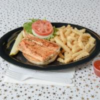Grilled Tilapia Sandwich · Grilled Tilapia sandwich with crinkle cut fries.