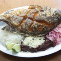 Fried Fish Plate · Served with rice, beans, plantains and salad. Fried fish, rice, beans, green banana and red ...