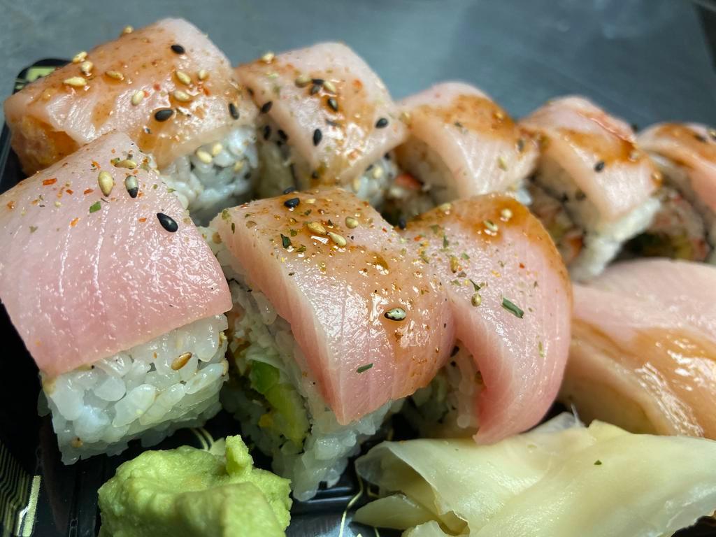Bloody Hamachi roll · Spicy tuna, crabmeat, and scallion tempura with avocado and Yellowtail on top