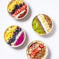 Rawtella Bowl · Banana, blueberry, mango, almond milk, topped with granola, hazelnut tella, strawberry and c...