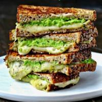 Grown Up Grilled Cheese · Provolone cheese, avocado and tomato, on sour dough.