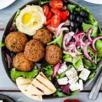 The Mediterranean Bowl · Baked falafel, red and white quinoa, cucumbers, tomatoes, mint, red onions, chickpeas and le...