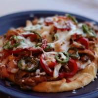 Mexican Pizza · Choice of veggie, steak, chicken, or pork. Served with your choice of toppings: jalapeños, r...