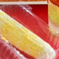 Elote Entero · Corn on the cobb comes with margarine, mayonnaise, grated cotija cheese, and optional pico d...
