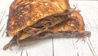 BBQ Beef Melt · BBQ beef, cheddar cheese & mayo on sourdough, pressed & melted to crunchy, gooey perfection!