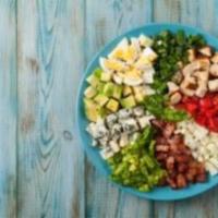 Cobb Salad · spring greens topped with house roasted chicken breast, thick bacon, gorgonzola. boiled egg,...