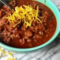 Homemade Chili with Cheese and Onions · Stew made with chili peppers or powder.