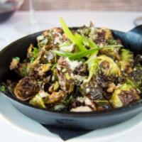 Crisp Pecan Brussels Sprouts · Brussels, candied pecans, sweet serrano sauce, shaved green onion, sprinkled Parmesan. Glute...