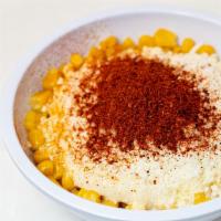 Elote Cup · Mexican Street Corn topped with mayonnaise, butter, cotija cheese, and chili powder.