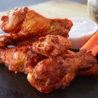 Union Chicken Wings · Large fresh cooked to order wings tossed in choice of sauce and served with dipping sauce, c...