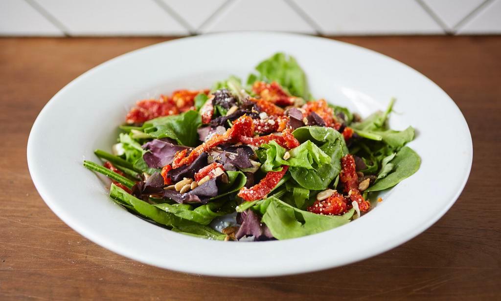 Union House Salad · Organic spring mix, goat cheese, sunflower seeds, sun-dried tomatoes tossed with a house-made balsamic dijon vinaigrette dressing.