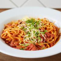 Spaghetti Bolognese · Our addicting slow simmered house-made meat sauce with fresh Parmesan.