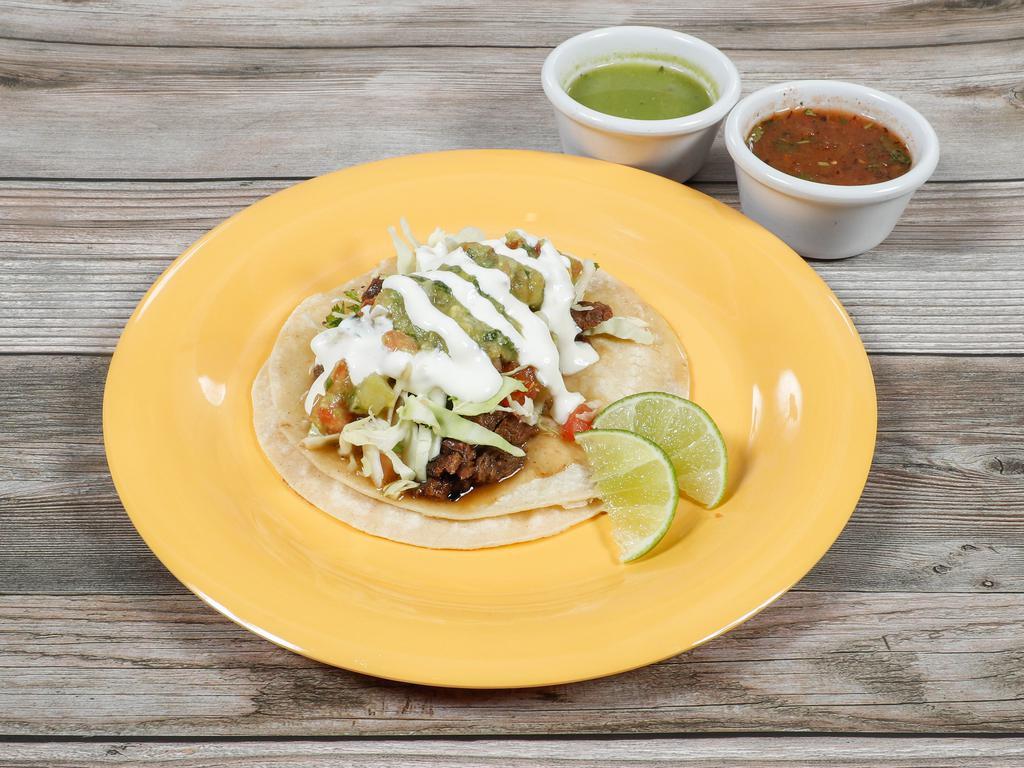 Supreme Taco · Same as regular taco with guacamole and sour cream.