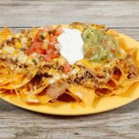 Meat Nachos · Served with your choice of meat, cheese, beans, salsa fresca, guacamole and sour cream.