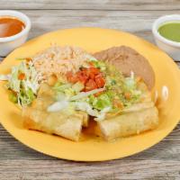 Vegan Flautas · 4 fried rolled corn taquitos with spiced potatoes, topped with  green enchilada sauce, lettu...