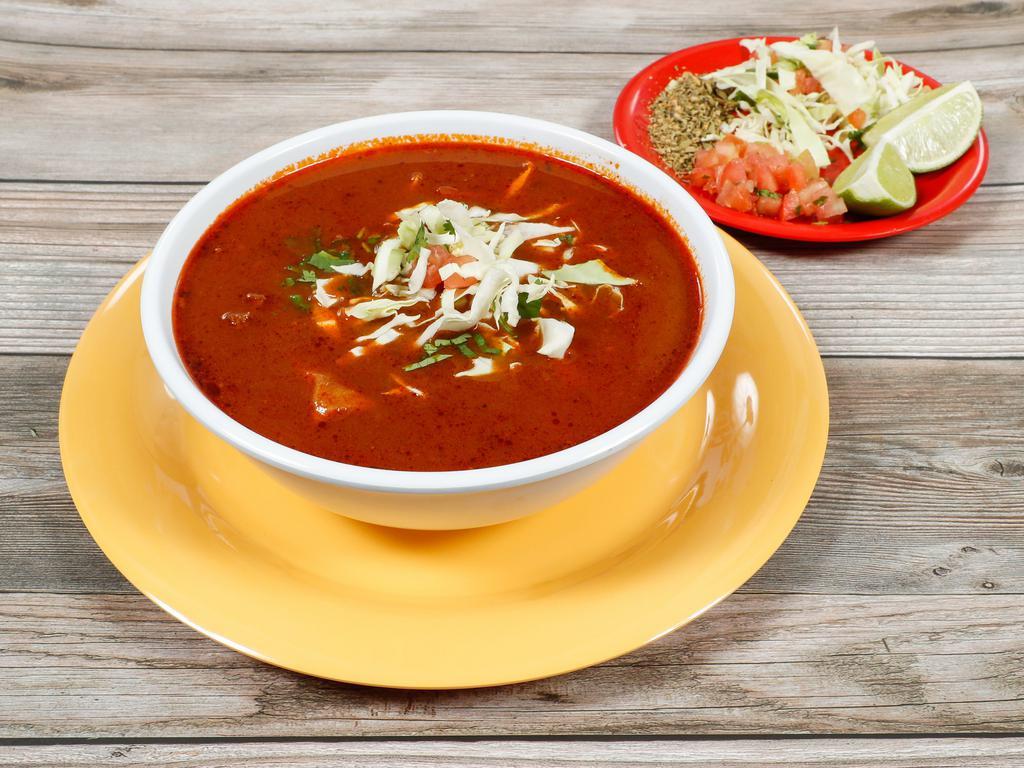 Pozole (Pork & Hominy soup) · An Authentic Guajillo hominy soup with pork! comes with cilantro, onions, cabbage, lime and oregano.
