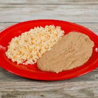 Rice & Beans (half side) · Half side of rice and refried beans.
