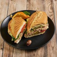 Pan Bagnat Sandwich · Tuna salad topped with iceberg lettuce, tomatoes, red bell peppers, cucumber, olive tapenade...