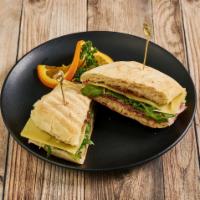 Prosciutto and Figs Sandwich · Thinly sliced Prosciutto di Parma, fig preserves, Gruyere cheese topped with arugula on a Fi...