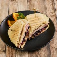 Muffaletta Sandwich · Diestel farms turkey breast, black forest ham, Genoa salami, provolone cheese topped with ol...