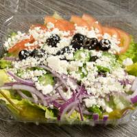 Greek Salad · Romaine lettuce, tomatoes, onions, cucumbers, feta cheese, black olives and pepperoncini.