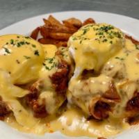 Pulled Pork Benedict · Piled with our honey chipotle pulled pork, poached egg and housemade hollandaise on english ...