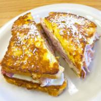 Monte Christo · Egg battered fried ham and Swiss sandwich on Texas toast | Served with Maple Syrup