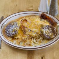 Roundhouse Special Breakfast · 2 eggs with bacon and sausage, hash browns smothered in green chile topped with melted chees...