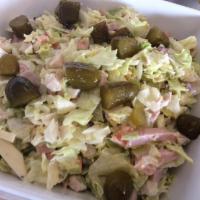 J.L. Hudson's Maurice Salad · Chopped lettuce, diced tomatoes, Swiss cheese, diced ham and turkey, all tossed in the speci...