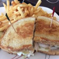 Turkey Reuben Sandwich · Our house cooked  turkey, homemade coleslaw and Swiss cheese on grilled rye
served with a th...