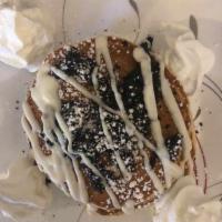 Oreo Pancakes · Buttermilk pancakes with Oreo in batter and topped with Oreo and cream cheese glaze 