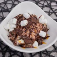 Cookie Monster · Hand whipped peanut butter mousse on top of an oreo cookie crust with toasted marshmallows, ...