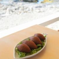 Beef Kibbeh · Lean beef mixed with bulgur wheat, stuffed with beef tips and onion.