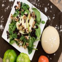 Spinach And Gorgonzola Salad · Baby spinach topped with Gorgonzola cheese, dried cranberries, onions and apple slices in ho...