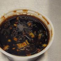 Dumpling Sauce (2oz) · A little bit of sweet, and little bit of spicy. Comes with our fried dumplings. Made in-house.