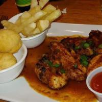 Boneless Chicken · Boneless, chicken is marinated in our signature blend of spicy Jamaican herbs, before it is ...