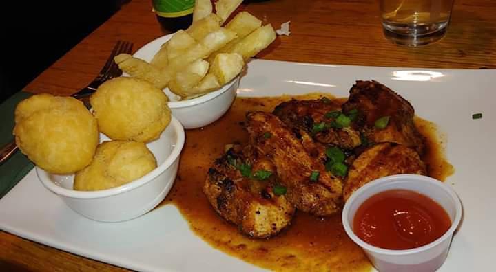 Boneless Chicken · Boneless, chicken is marinated in our signature blend of spicy Jamaican herbs, before it is grilled to perfection. Served with onions and peppers and our signature spicy jerk sauce. Served with soup or salad and an additional side.