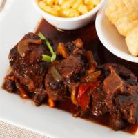 Oxtail Stew · Oxtail is a bony rich meat slow simmered to a flavorful tender succulent treat.