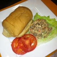 Chicken-salad Sandwich -Jerk · Chunks of spicy jerk chicken chopped with a blend of herbs and spices, tomato and lettuce ge...