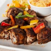 Jerk Pork - One pound · One of the most traditional Jamaican dishes pork steaks marinated in our spicy blend of Jama...