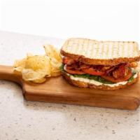 The B.L.T. · Crispy bacon, lettuce, tomato, and mayo on locally baked white or wheat bread.