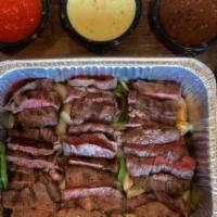 Steak Fajita Family Meal · Enjoy Our Steak Family Meal, Includes Mexican Rice, Refried Beans, Lettuce, Sour Cream, Pico...
