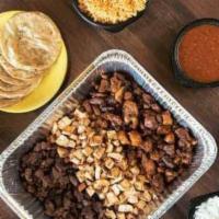 Street Taco Family Meal · Feeds 6 - 8 people comes with Chicken, Steak and Pastor Rice, Beans, Chopped onions, cilantr...