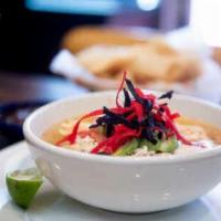 Xochitl Soup · Hearty chicken broth with pulled chicken breast, rice, diced avocado, pico de gallo and tort...